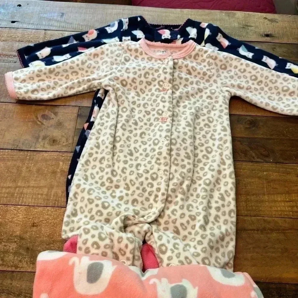 Six Carter’s Fleece Footie Pajamas